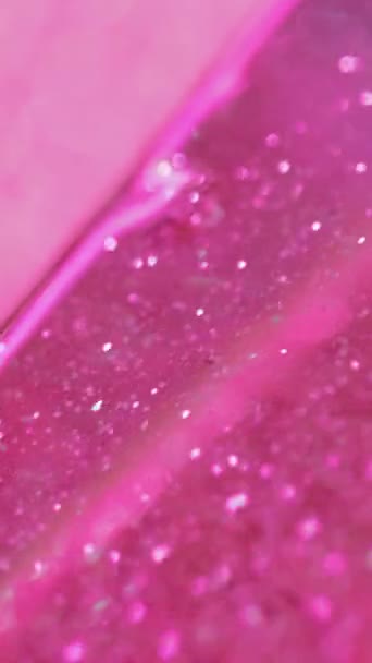バーティカルビデオ バックグラウンドを明るく グリッターサンド トレンディな抽象的魅惑的な催眠術に広がるボケのライトが付いている明るいピンクの光の流動的なペンキの波 — ストック動画