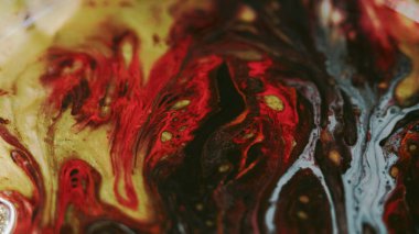 Mürekkep damlası. Boya karışımı. Bulanık altın sarısı, mavi, parlak, parlak, parlak, parlak partiküller yağ kabarcıkları, doku, emülsiyon karışımı, soyut sanat arkaplanı..