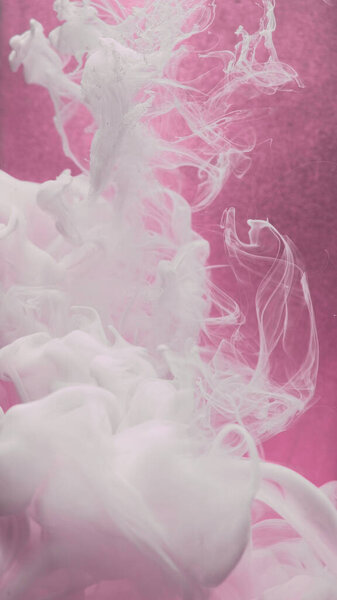 Smoke art. Paint water swirl. Ink cloud. White silk acrylic liquid flow texture haze motion on defocused pink color grain abstract background.