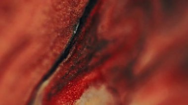 Parlak boya akışı. Mürekkep suyu. Bulanık kırmızı renkli sim parçacıkları mermer dokular sıvı sızıntılar dalga karışımı soyut sanat arkaplanı.