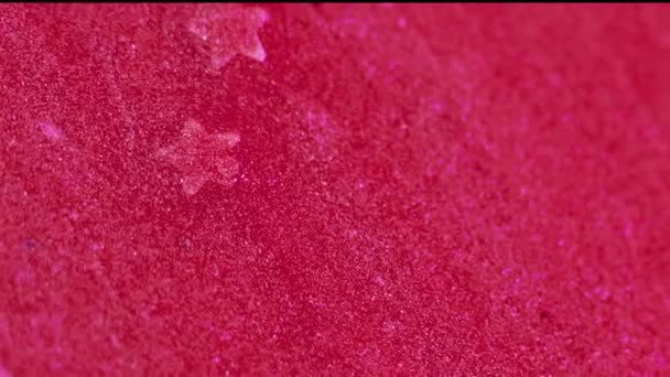 グリッターの背景 液体フロー スパークリングウェーブ 輝くピンクの輝くテクスチャ抽象物質の流出の流れ 星のシーンが表面に広がる — ストック動画