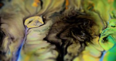 Parıldayan sıvı karışımı. Köpüklü boya. Odaklanmamış siyah, mavi, altın rengi holografik, parlak toz parçacıkları desen, mürekkep pigmenti sızıntısı hareket soyut sanat arkaplanı..