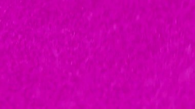 Işıldayan mürekkep arka planı. Parıldayan sıvı. Bulanık parlak tahıl dokusu moda pembe sıvı boya akışı dinamik, parlak, yaratıcı, soyut sanat eserlerinde yayılıyor..