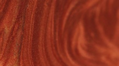 Parlak mürekkep akışı. Geometrik arkaplan. Odaklanmamış bronz kırmızı renk parıldayan parçacıklar boya emülsiyon hareket kübü soyut sanat şekli.