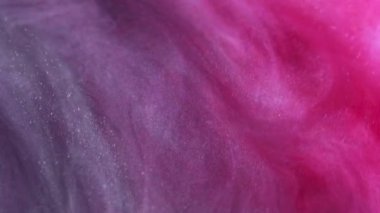 Işıldayan sıvı. Mürekkep suyu karışımı. Girdap sanatı. Kırmızı pembe renk spiral akış parlak boya sim partikülleri sıvı soyut arkaplan.