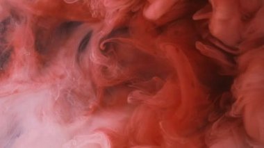 Patlama bulutu. Mürekkep damlası. Odaklanmamış kırmızı renk toz dokusu duman dalgası akışı siyah soyut sanat arka planında hareketi gösterir.