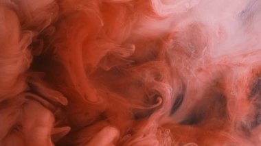 Patlama bulutu. Mürekkep damlası. Odaklanmamış turuncu renkli toz parçacıkları soyut sanat arkaplanı yayarak duman dalgası akışını oluşturur.