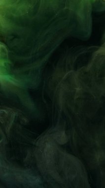 Patlama bulutu. Mürekkep damlası. Odaklanmamış yeşil renkli sim dokusu ruhani duman dalgası akışı koyu soyut sanat arkaplanı.