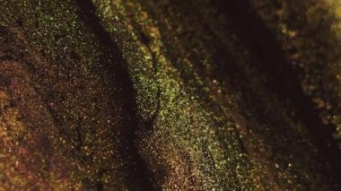 Bokeh hafif dokusu. Islak sim akışı. Bulanık altın yeşili siyah renk parlayan parlak mürekkep damlaları dalga karışımı soyut sanat arkaplan.