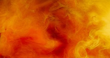 Parlak buhar. Parlak parçacıklar. Mürekkepli su sıçraması. Odaklanamayan sihirli turuncu kırmızı sıvı hipnotize edici soyut sanat yanan arka plan.