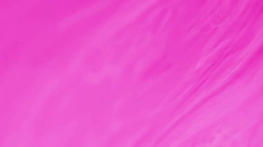 Sıvı arka plan. Akrilik boya. Renk akışı. Işıldayan parçacıkların olduğu bulanık pembe pigmentler soyut sanatta suda hipnotik hareketler yapar..