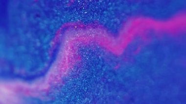 Islak sim dokusu. Bokeh ışığı. Odaklanmamış mavi pembe renkli parıldayan parçacıklar mürekkep akışı soyut sanat arkaplanı.