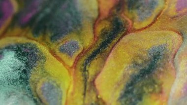 Işıldayan sıvı sıçraması. Boya karışımı. Bulanık sarı mavi renk parlak parçacıklar mürekkep emülsiyon mermer akış karışım mermer doku soyut sanat arka planı.