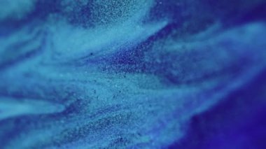Parlak boya dalgası. Mürekkep akışı. Bulanık mavi renkli parlak desenli ıslak parlatıcı dökülme çağlayan cazibe soyut arka plan.