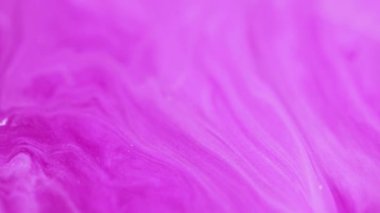 Boya dalgası. Bulanık arkaplan. Odaklanmamış pembe renk parıldayan parıltılı mermer desen akrilik emülsiyon akış hareketi soyut sanat.