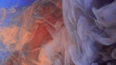 Mürekkep damlası. Duman bulutu. Odaklanmamış mavi turuncu renkli sim parçacıkları. Doku buharı. Girdap açıcı hareketi..