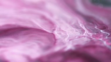 Görüntü dalgası. Mürekkep karışımı. Odaklanmamış pembe renkli mermer parçacıklar. Sıvı emülsiyon akış hareketi. Soyut sanat arka planı..