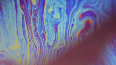 Yağlı gökkuşağı. Görünmez mürekkep karışımı. Odaklanmamış mavi turuncu renk akrilik boya karışımı dalga akışı psikedelik sanat arka planı.