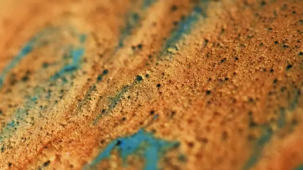 stock image Golden spill. Glitter wave. Defocused orange bronze blue color shimmering particles texture paint stream flow bokeh light abstract art background.