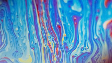 Boya dökülmüş. Görünmez mürekkep karışımı. Odaklanmamış mavi turuncu renk akrilik boya karışımı dalga dalgası psikedelik soyut sanat arka planı.