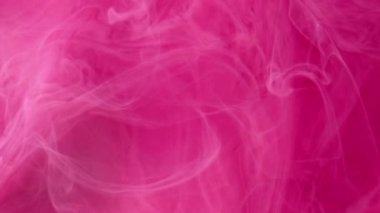 Sis bulutu. Boya suyu sıçraması. Odaklanmamış pembe renk toz parçacıkları buhar yüzüyor hareket eden soyut sanat arka planını yayıyor.