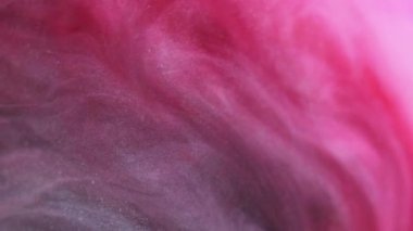 Işıldayan sıvı. Mürekkep suyu karışımı. Girdap sanatı. Kırmızı pembe renk spiral akış parlak boya sim partikülleri sıvı soyut arkaplan.