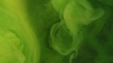 Yeşil duman. Boya su sıçratır. Odaklanmamış neon rengi parıldayan parçacıklar dokusu duman dalgası soyut sanat arkaplanı.