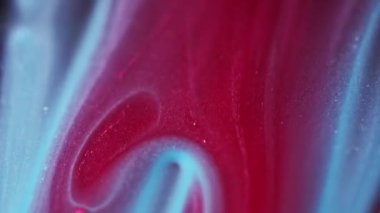 Parıldayan sıvı dökülmüş. Bokeh ışığı. Odaklanamayan kırmızı mavi renk kum dokusu mürekkep dalga hareketi soyut sanat arkaplanı.