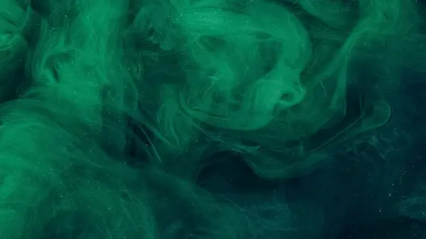 stock image Glitter ink water. Smoke cloud. Defocused green color shiny particles texture explosion vapor flow abstract art background.