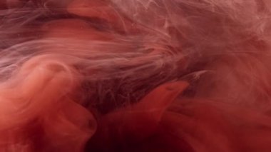 Sis bulutu. Sihir. Yüzen mürekkep buharı karışımı. Koyu arkaplan üzerinde turuncu simli sis hareketi gizemli dalga ışıl ışıl doku sanatı.