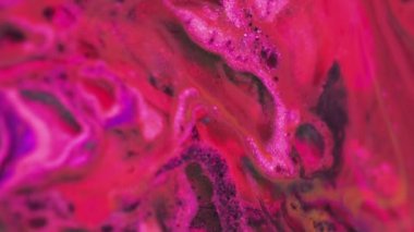 Su karışımı boya. Parıldayan sıvı. Cazibeli bir doku. Bulanık parlak neon pembe pembe renk ışıl ışıl mürekkep kabarcıkları girdaplı soyut sanat arkaplanı.