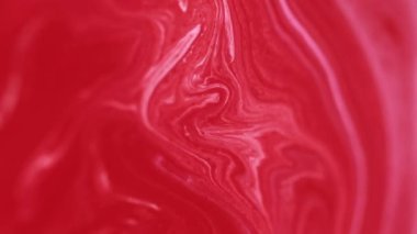 Boya dökülmüş. Akrilik boya dalgası. Odaklanmamış kırmızı beyaz pigment sıvı mürekkep girdaplı mermer doku karışımı sıvı emülsiyon harmanlama hareketi soyut sanat arka planı.
