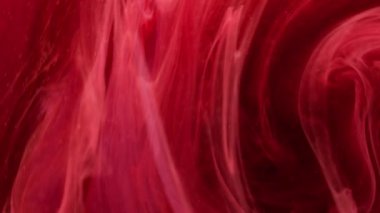 Sıcak hava dalgası. Su karışımı boya. Odaklanmamış kırmızı parlayan alev buharı dokusu yüzen mürekkep döndürme akışına, hipnotik hareket soyut sanat arkaplanına neden olur..