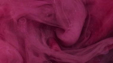 Sis bulutu. Boya suyu karışımı. Odaklanmamış pembe renkli toz parçacıkları koyu soyut sanat arka planında sis dalgası hareketi.