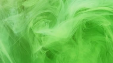 Dikey video. Sis hareketi. Haze bulutu. Işıl ışıl yeşil mürekkep. Mistik dalga dokusu. Altın parıltılı arka planda girdap gibi soyut sanat eserleri yayıyor..