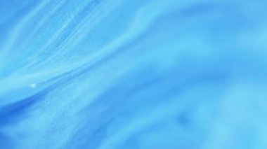 Mürekkep karışımı. Bulanık arkaplan. Odaklanamayan mavi renk parıldayan parıltılı mermer desen akrilik emülsiyon akış hareketi soyut sanat.