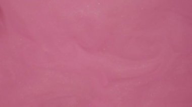 Işıldayan buhar. Sis bulutu. Odaklanmamış pembe parlak parçacıklar su sıçratır akış hareketini soyut sanat arkaplanını boyar.