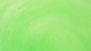 Parlak boya. Renkli karışım. Odaklanamayan parlak yeşil bulut, soyut modern sanat arka planında ilerleyen mürekkep buğusu girdabına sıçrıyor.