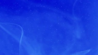 Su girdabı. Sis etkisi. Odaklanmamış parlak mavi renkli sıçrama boya mürekkebi sihirli duman soyut sanat arka planda hareket.