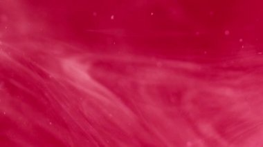 Boya sıvısı damlası. Duman bulutu. Odaklanmamış kırmızı renk parıldayan parlak boya soyut sanat arka planında yüzen köpüklü su damlası.