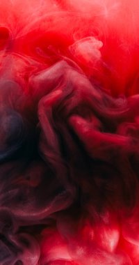 Sigara arkaplanı. Boya sıçraması. Odaklanmamış kırmızı renkli mürekkep suyu harmanı. Parıldayan parıltı bulutu. Yüzen dalga bulutu..