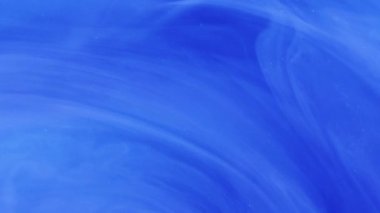 Işıltılı girdap. Işıldayan girdap. Odaklanmamış parlak mavi sıçrama parçacıkları soyut sanat arka planında hareket eden boya mürekkebi duman bulutu.