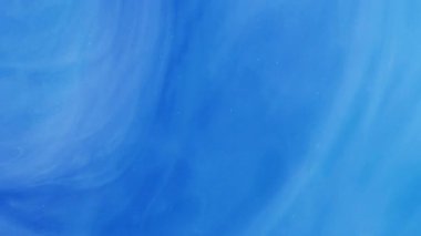 Işıltılı girdap. Işıldayan girdap. Odaklanmamış parlak mavi sıçrama parçacıkları soyut sanat arka planında hareket eden boya mürekkebi duman bulutu.