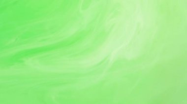 Parlak boya. Renkli karışım. Odaklanamayan parlak yeşil bulut, soyut modern sanat arka planında ilerleyen mürekkep buğusu girdabına sıçrıyor.