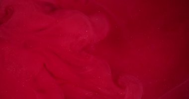 Renkli duman kokusu. Pigment karışımı. Kıpkırmızı parlayan boya bulutu. Parlak dalga boyası patlama sıvısı, arkaplan bulanık dokusu.