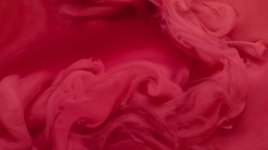 Duman mürekkebi. Fış sanatı. Soyut akrilik zemin üzerinde yüzen akrilik su karışımı sisli, pembemsi kırmızı sıvı doku..