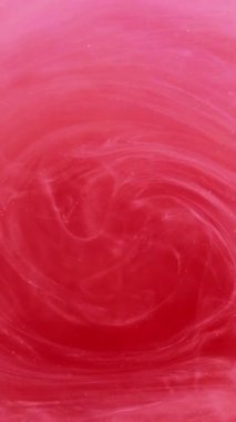 Dikey video. Duman sıçrat. Mürekkep suyu. Soyut sanat arka planında hareket eden sönük pembe, beyaz, çok renkli, bulanık bulutlu buhar buharı..