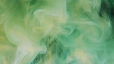 Parıldayan bulut. Mürekkepli su sıçraması. Odaklanmamış yeşil altın rengi ışıl ışıl desen sisi yayılan girdap hareket eden soyut sanat arkaplanı.