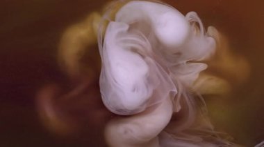 Dalga girdabı. Işıl ışıl geçmiş. Odaklanmamış beyaz turuncu renkli parlak parçacıklar soyut kara sanata yayılan mürekkep dumanı..