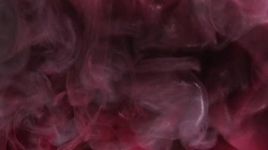 Parıldayan bulut. Mürekkepli su sıçraması. Odaklanmamış pembe renkli parlak desenli sis perdesi yayılan girdap hareketli soyut sanat arkaplanı.